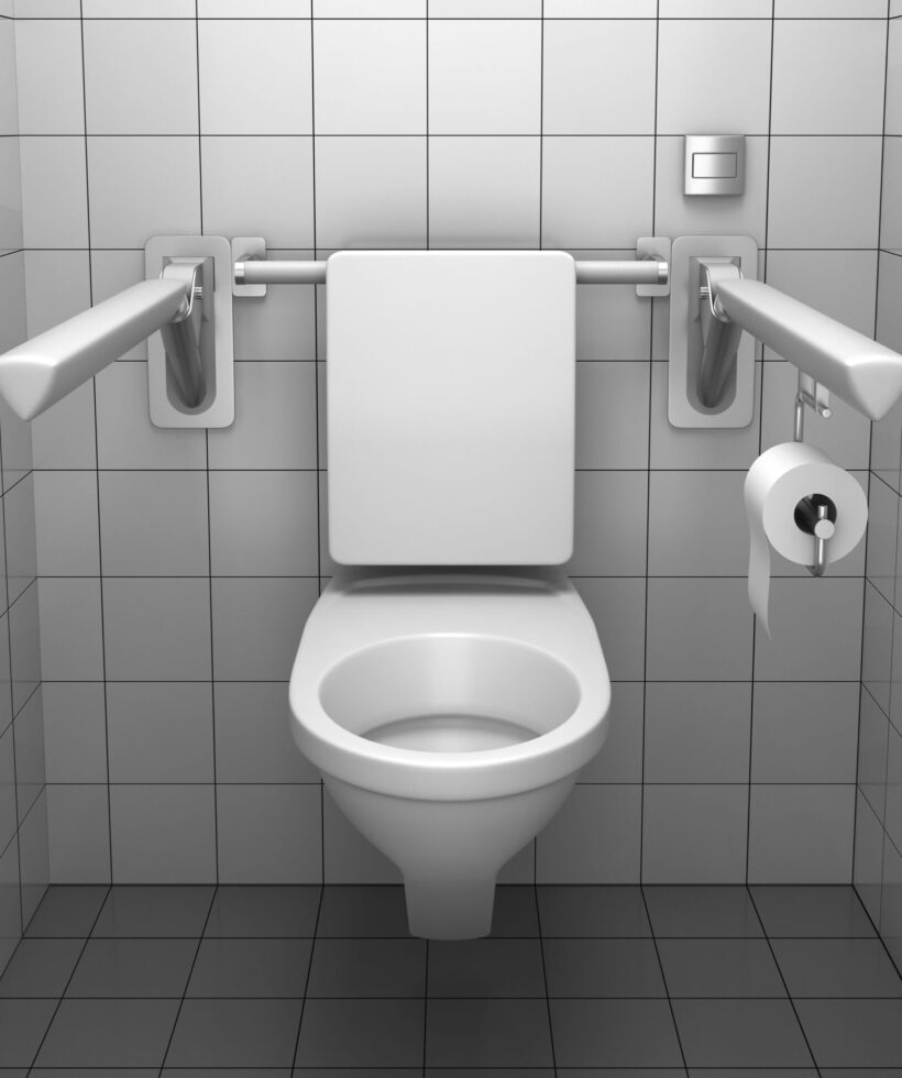 toilet for invalids with white tile on wall